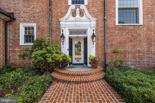 property entrance with brick siding