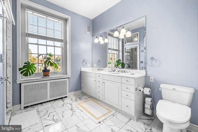 full bath featuring radiator, baseboards, a sink, toilet, and marble finish floor