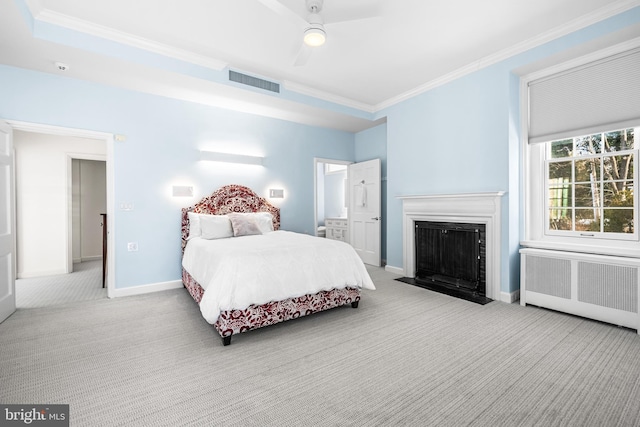 bedroom featuring visible vents, radiator, crown molding, and carpet