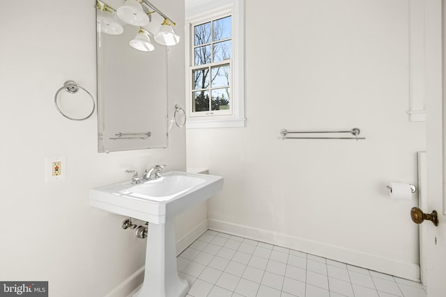 bathroom with tile patterned floors and baseboards