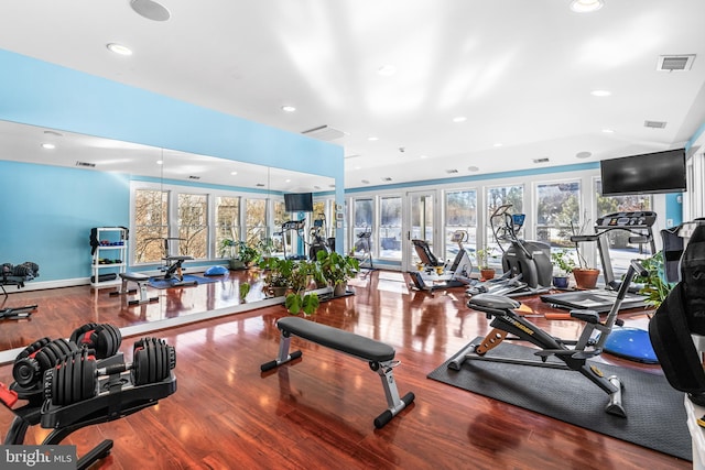 workout area with recessed lighting, visible vents, a healthy amount of sunlight, and wood finished floors