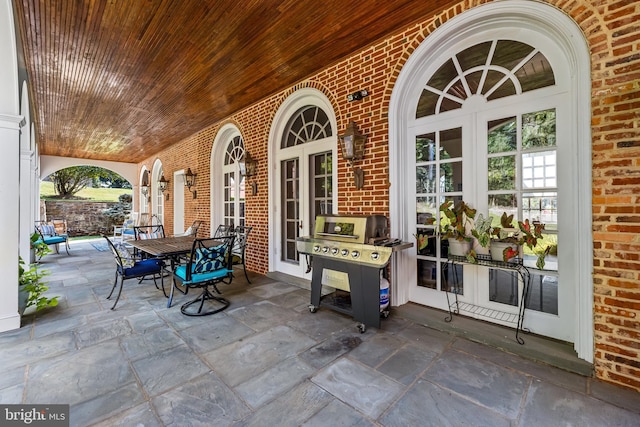 view of patio with area for grilling and french doors