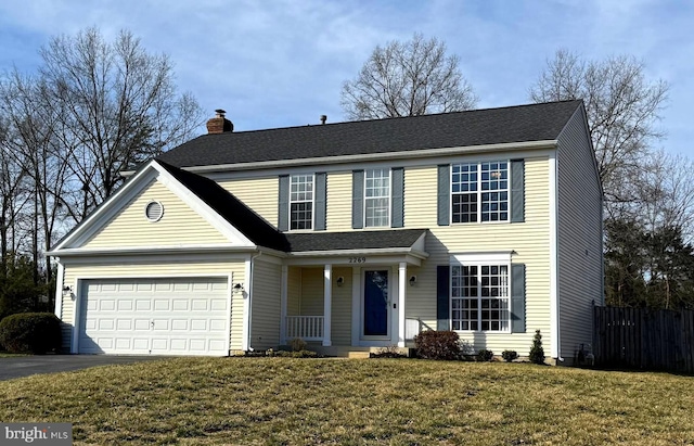 view of front of property featuring fence, an attached garage, a chimney, a front lawn, and aphalt driveway