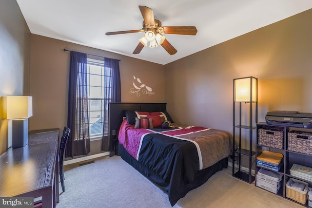 bedroom featuring ceiling fan, carpet, visible vents, and baseboards