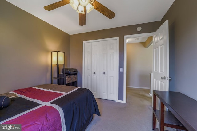 bedroom featuring a ceiling fan, baseboards, a closet, and carpet floors