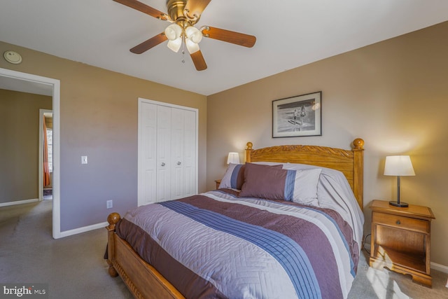 carpeted bedroom featuring a closet, ceiling fan, and baseboards