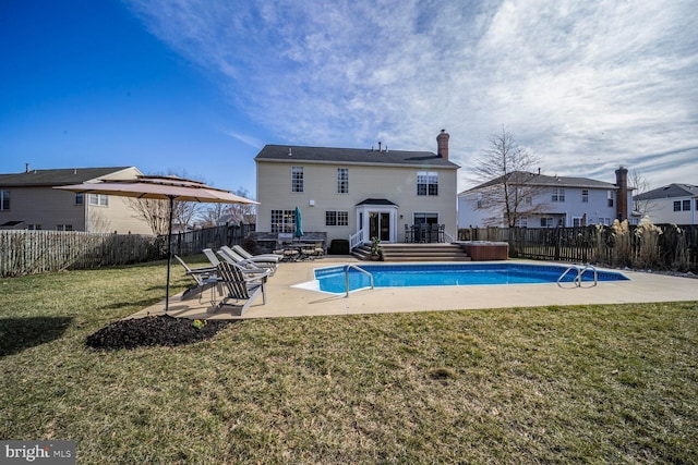 view of pool featuring a yard, a patio, a fenced in pool, and a fenced backyard