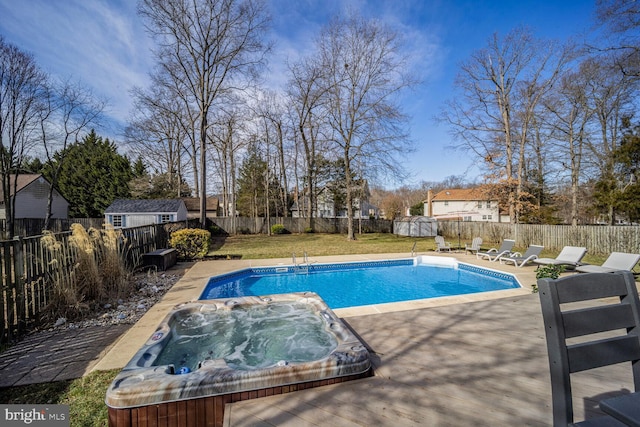 view of pool with a fenced in pool, a yard, an outdoor hot tub, a fenced backyard, and a patio