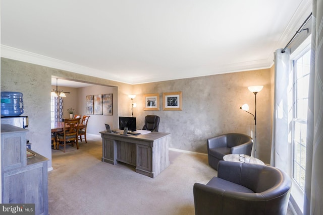 office area featuring crown molding, baseboards, and light carpet