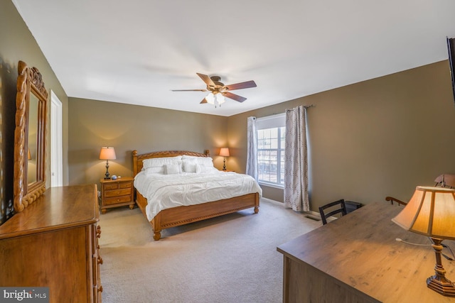 bedroom featuring carpet, baseboards, and ceiling fan