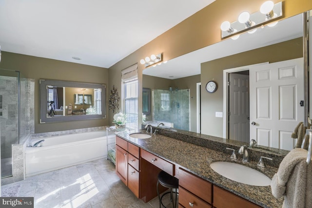 full bathroom with a garden tub, double vanity, a stall shower, and a sink