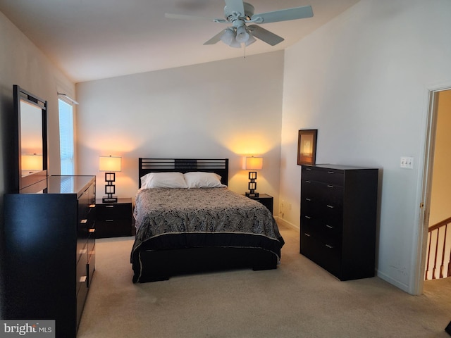 bedroom featuring baseboards and light carpet