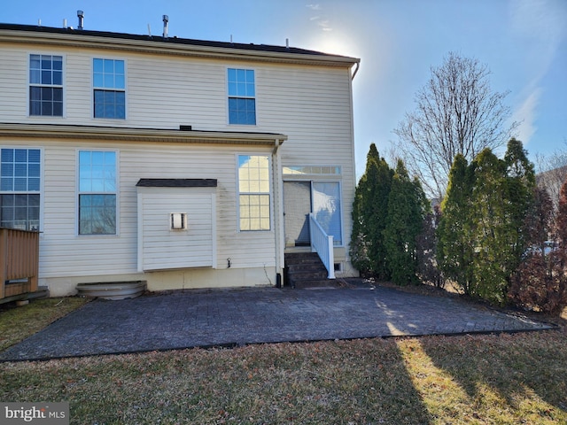 back of property featuring a patio