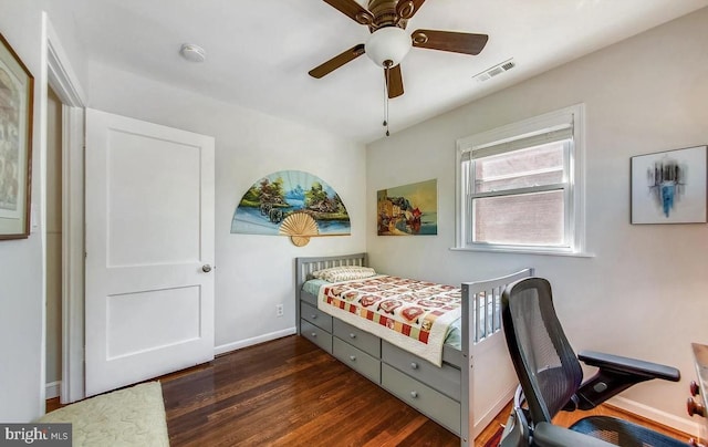 bedroom featuring a ceiling fan, dark wood-type flooring, baseboards, and visible vents