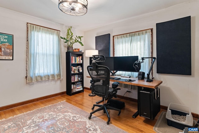 office with wood finished floors and baseboards