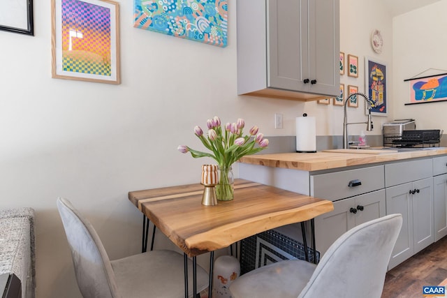 dining area featuring dark wood-style floors