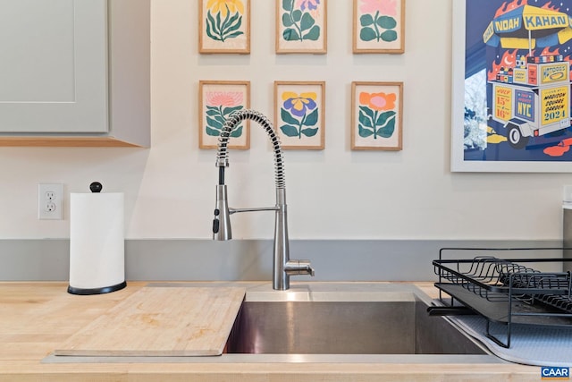 details featuring a sink and light countertops