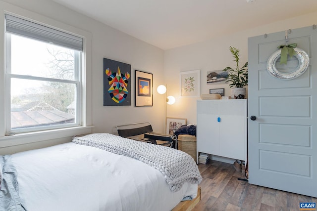 bedroom featuring wood finished floors