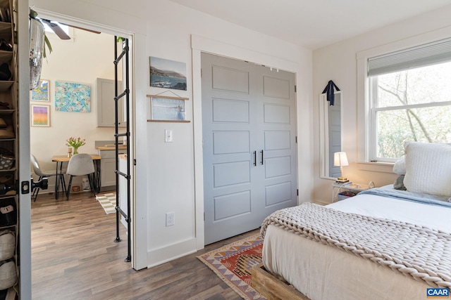 bedroom featuring baseboards and light wood-style floors