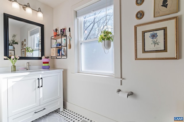 bathroom with baseboards and vanity