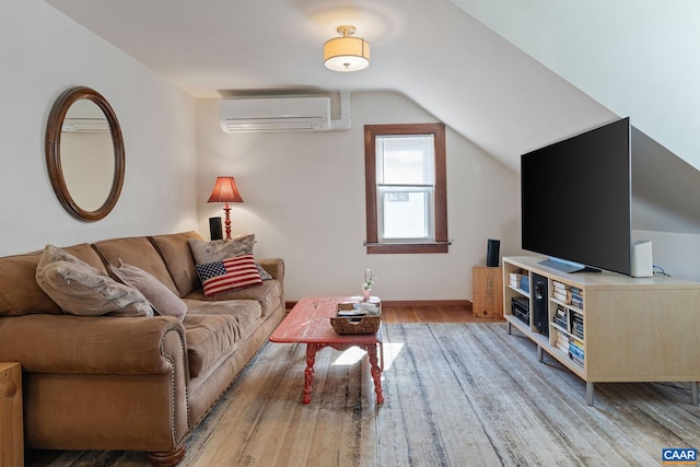 living area featuring lofted ceiling, light wood-style floors, and a wall mounted AC