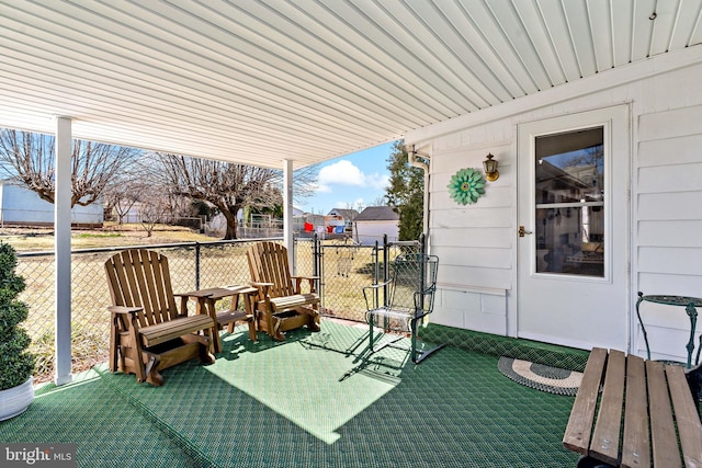 view of patio featuring fence