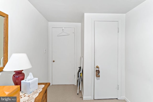 interior space featuring light colored carpet