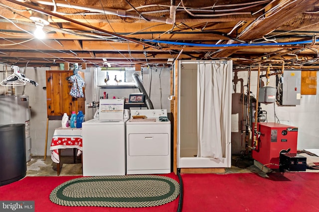 basement with washer and dryer, electric panel, a heating unit, and electric water heater