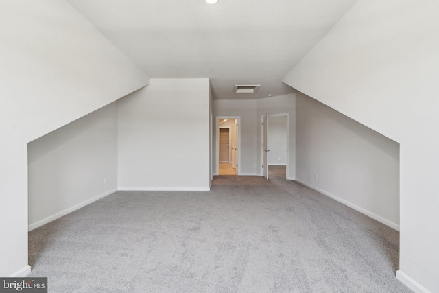 bonus room featuring carpet flooring, baseboards, and visible vents