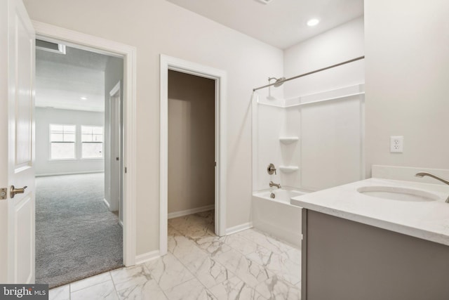 full bathroom with recessed lighting, baseboards, marble finish floor, and shower / bath combination