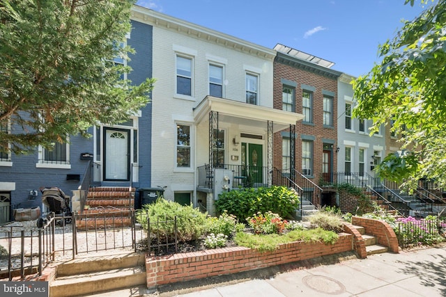 106 15th St SE, Washington, DC 20003 - townhome / multi-family property featuring entry steps, brick siding, and stairway