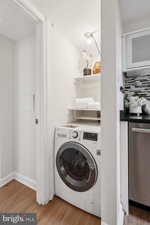106 15th St SE, Washington, DC 20003 - laundry room with washer / dryer and wood finished floors
