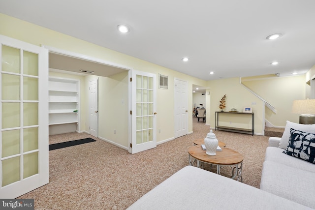 living area featuring visible vents, recessed lighting, stairs, and carpet