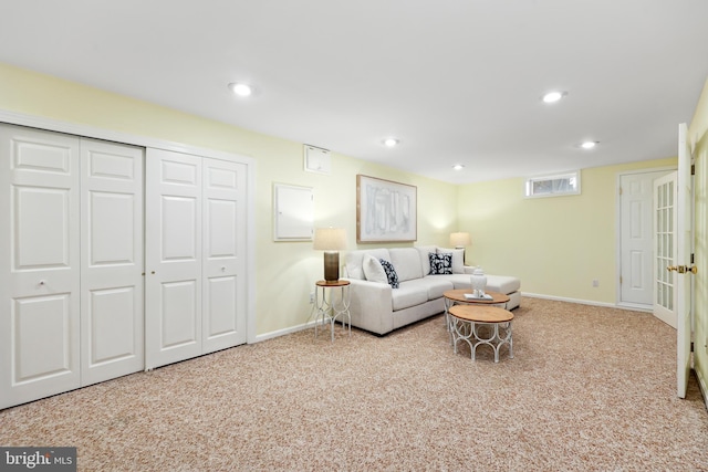 living area with recessed lighting, baseboards, and carpet