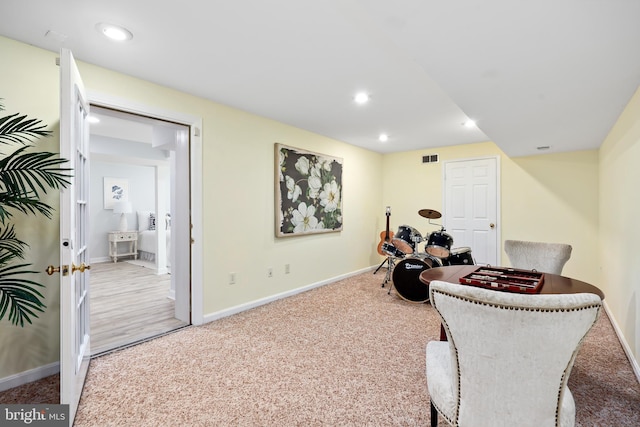 sitting room with carpet flooring, recessed lighting, visible vents, and baseboards