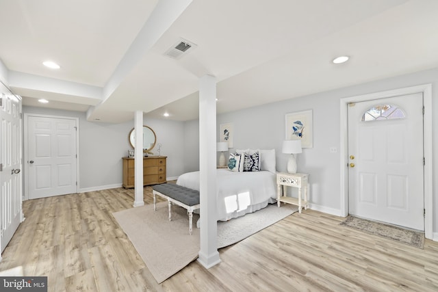 bedroom with light wood finished floors, visible vents, and recessed lighting