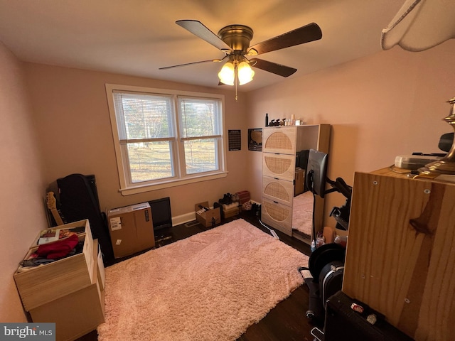 bedroom with a ceiling fan and wood finished floors