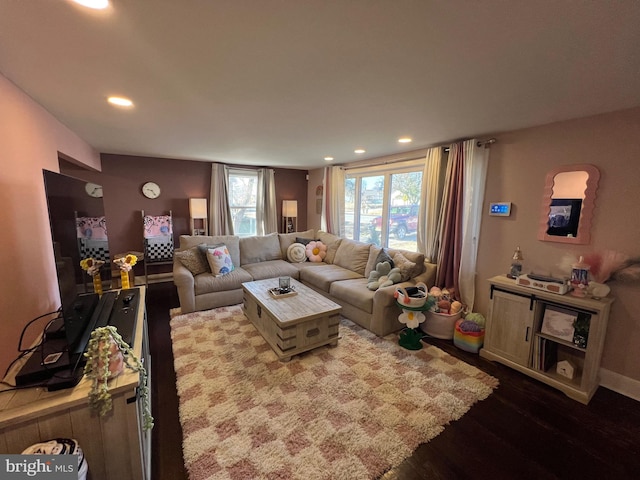 living room featuring recessed lighting and dark wood-type flooring