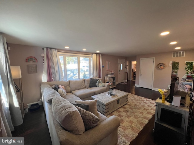 living area with recessed lighting, visible vents, baseboards, and dark wood-style floors