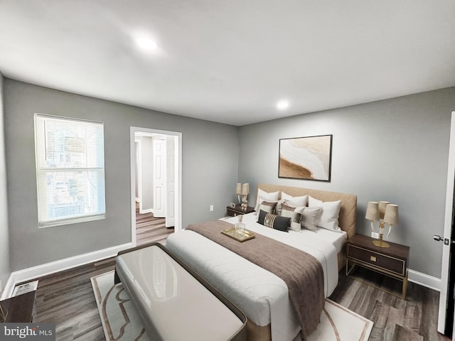 bedroom featuring dark wood finished floors, recessed lighting, and baseboards