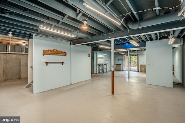 basement featuring stairs