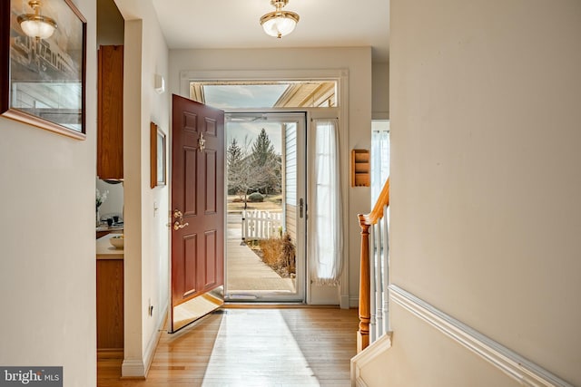 foyer entrance with light wood-style floors