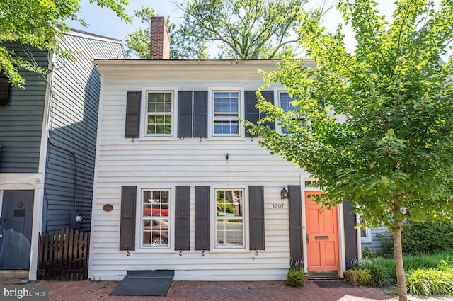 view of front of home with a chimney