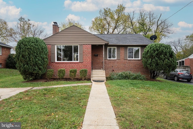 bungalow with a front yard, brick siding, roof with shingles, and a chimney