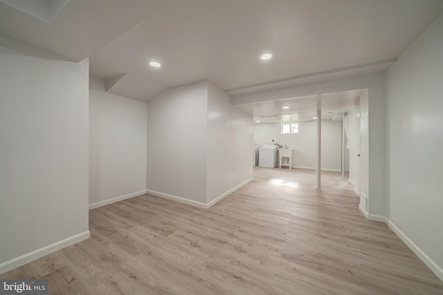 below grade area featuring recessed lighting, baseboards, and wood finished floors