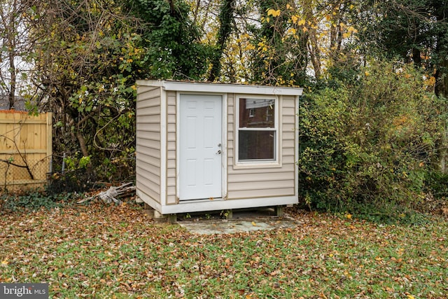 view of shed with fence