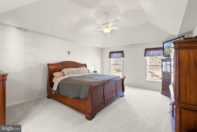 bedroom featuring a ceiling fan, baseboards, visible vents, lofted ceiling, and light carpet