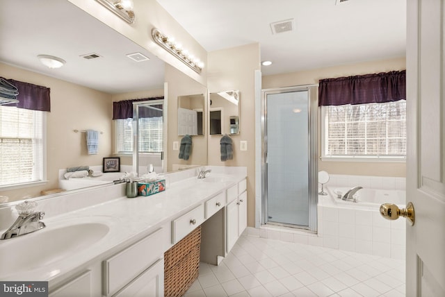 bathroom with a sink, visible vents, and a stall shower