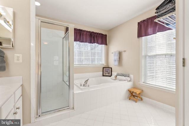 bathroom featuring vanity, a shower stall, plenty of natural light, and a bath