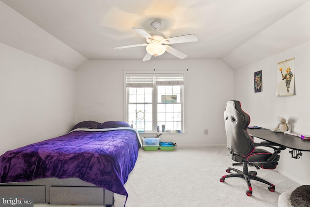 carpeted bedroom featuring a ceiling fan, baseboards, and vaulted ceiling